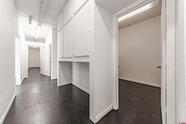 an empty room with wooden floor