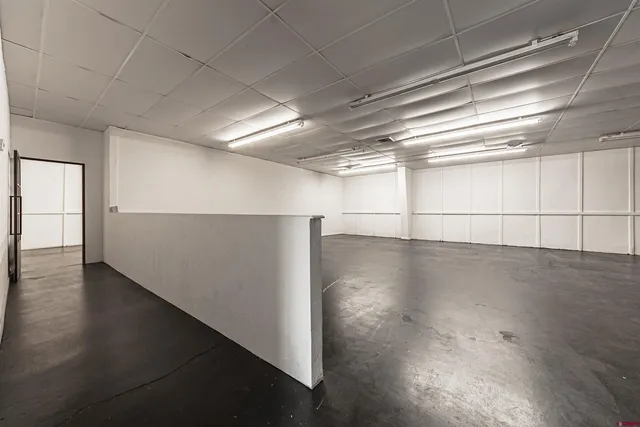 an empty room with wooden floor