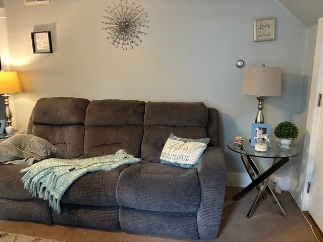 a bedroom with a bed and chair