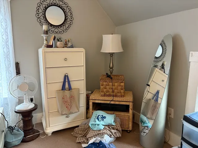 a room with a fireplace and a chandelier