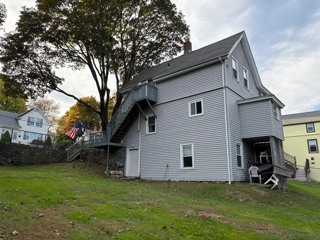 a view of a house with a yard