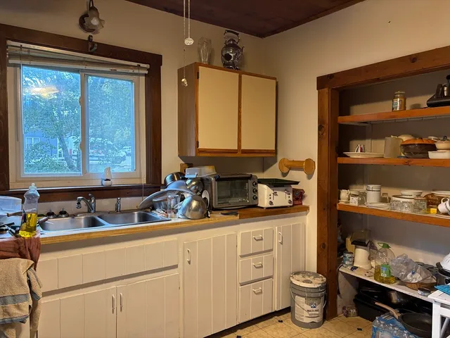 a bathroom with a sink and a window
