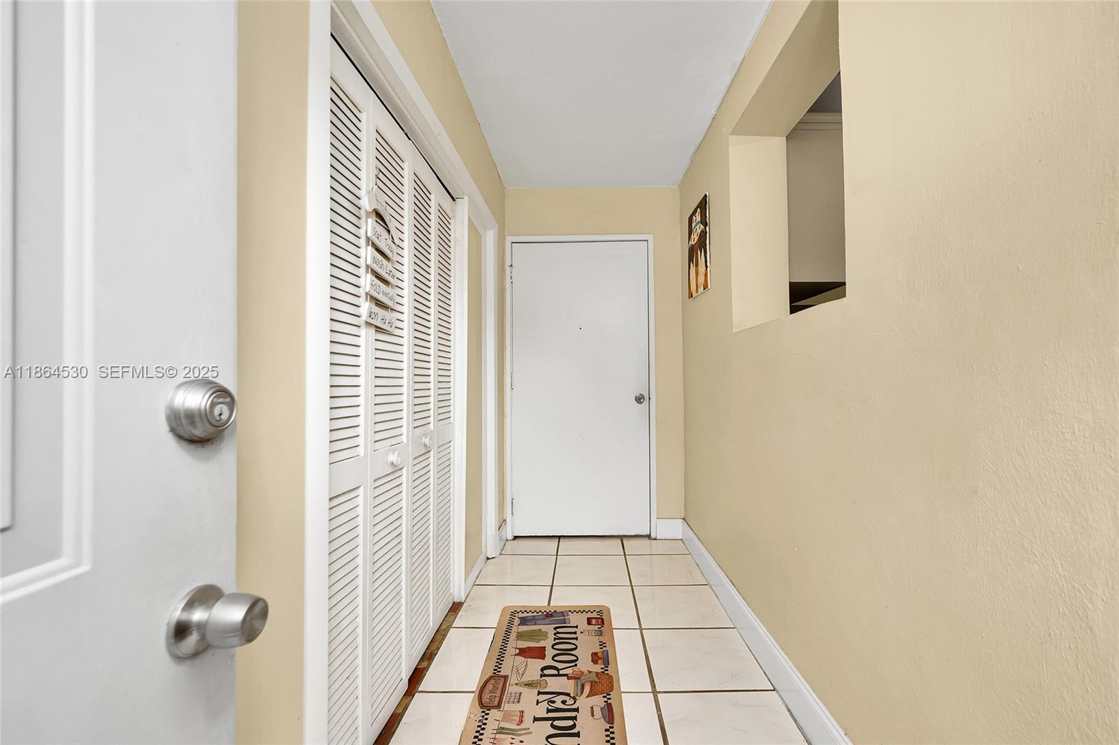 1220 Northwest 88th Street Miami, FL 33147 - Photo 13 of 31 a view of a hallway with windows
