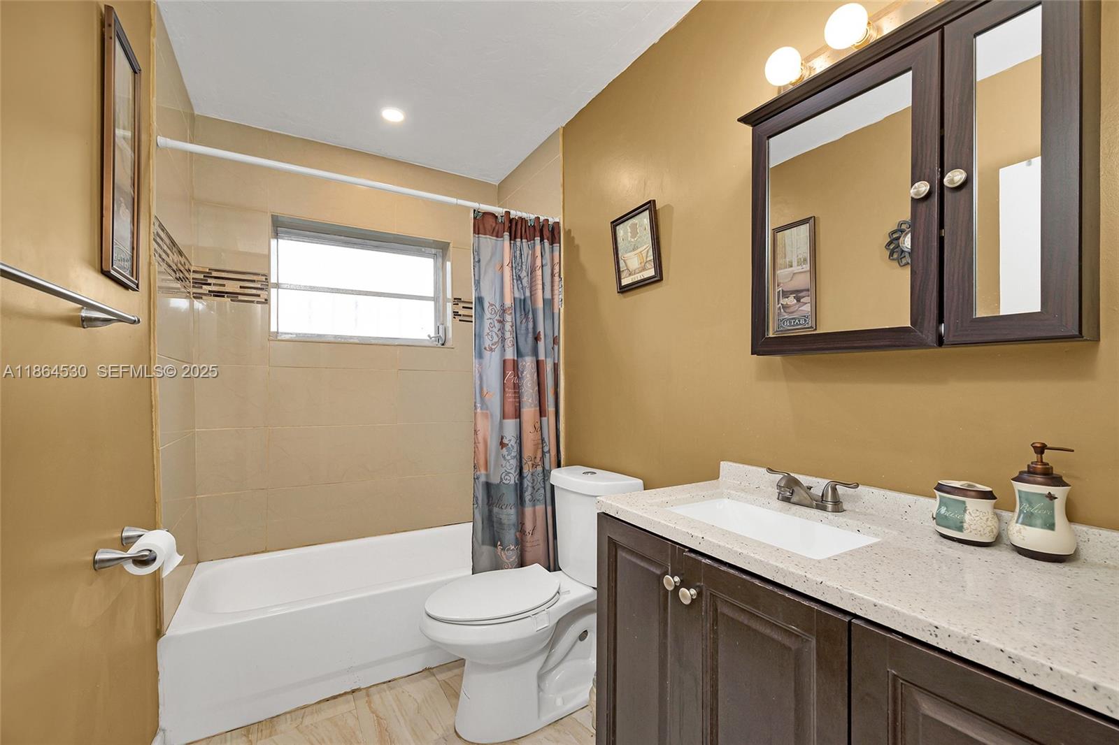 1220 Northwest 88th Street Miami, FL 33147 - Photo 16 of 31 a bathroom with a granite countertop sink toilet and shower