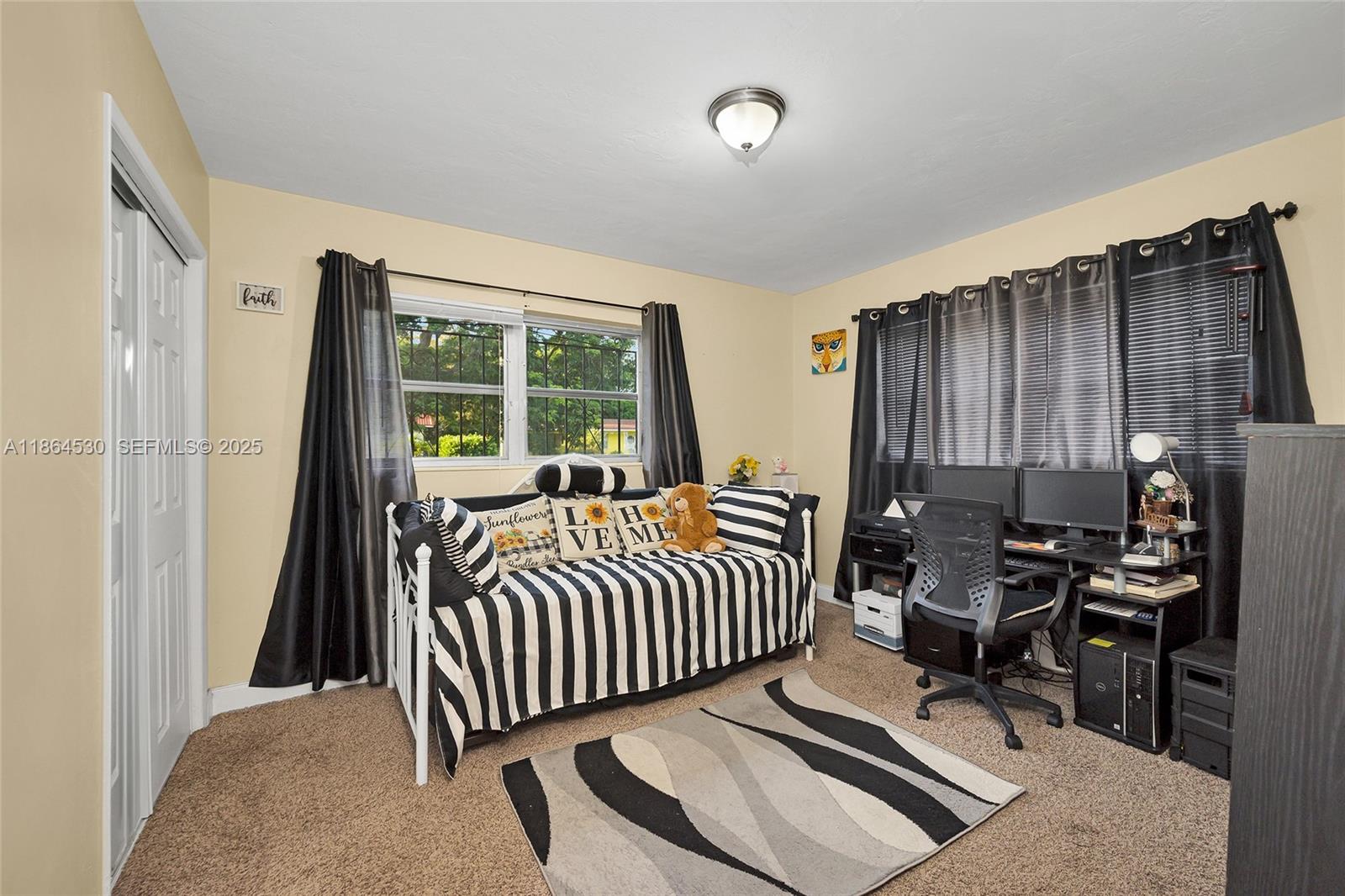 1220 Northwest 88th Street Miami, FL 33147 - Photo 17 of 31 a bedroom with a bed and a window