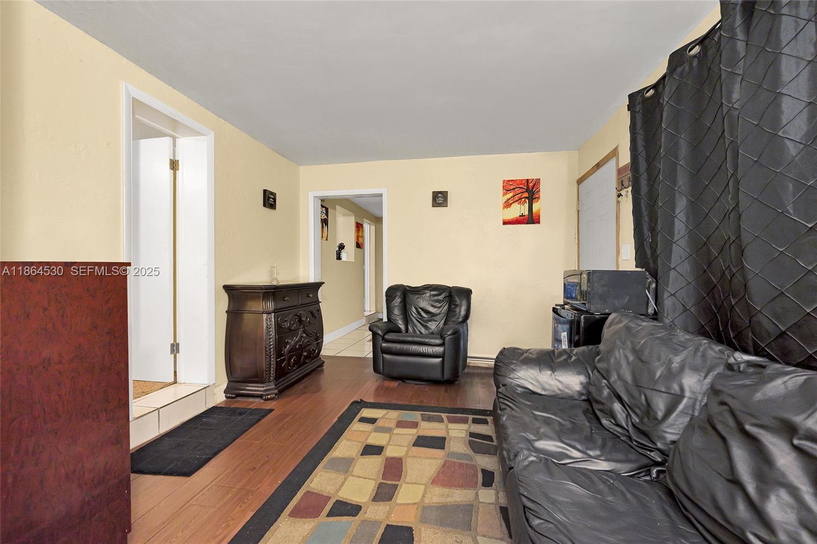 1220 Northwest 88th Street Miami, FL 33147 - Photo 24 of 31 a bedroom with furniture and a rug