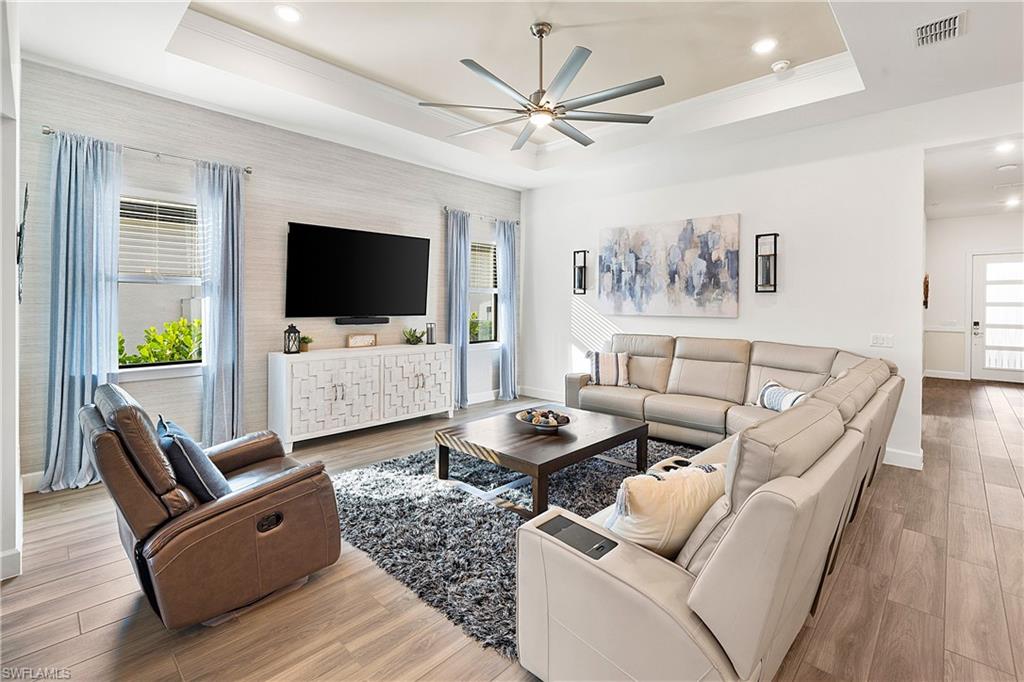 20549 Napa Loop Estero, FL 33928 - Photo 12 of 50 a living room with furniture and a flat screen tv