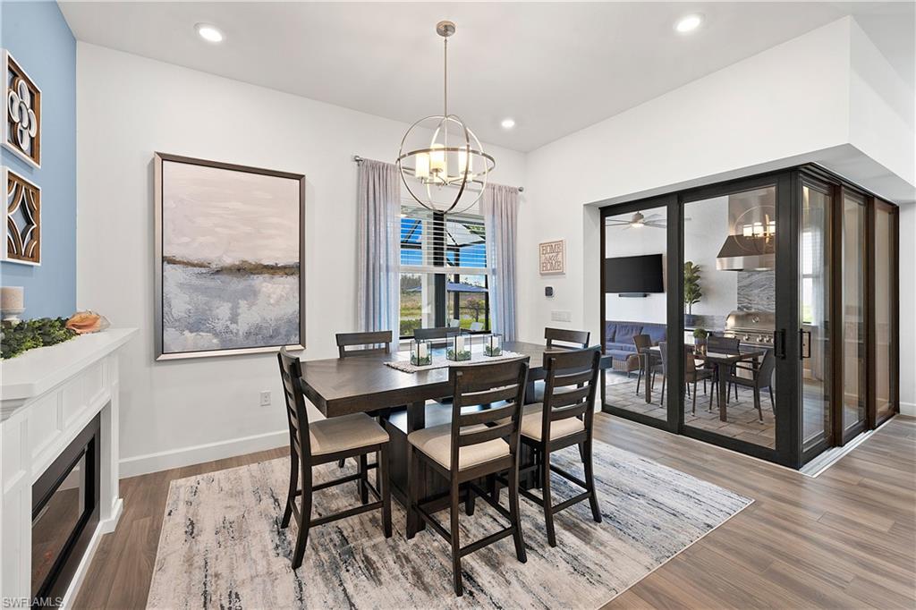 20549 Napa Loop Estero, FL 33928 - Photo 22 of 50 a view of a dining room with furniture window and wooden floor