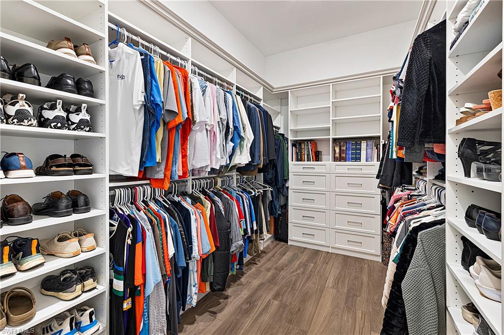 20549 Napa Loop Estero, FL 33928 - Photo 24 of 50 a view of walk in closet with clothes and shoes