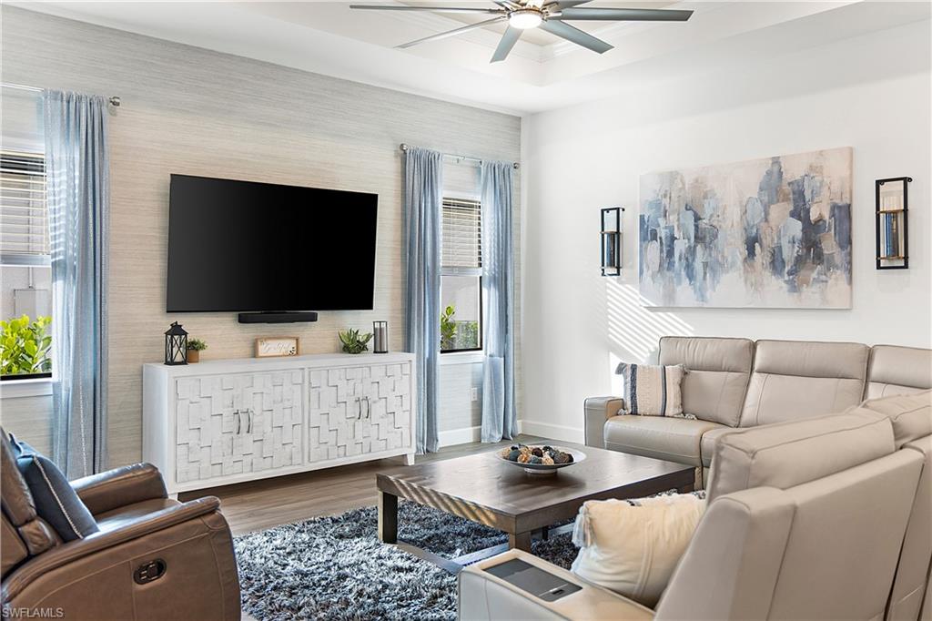 20549 Napa Loop Estero, FL 33928 - Photo 34 of 50 a living room with furniture and a flat screen tv