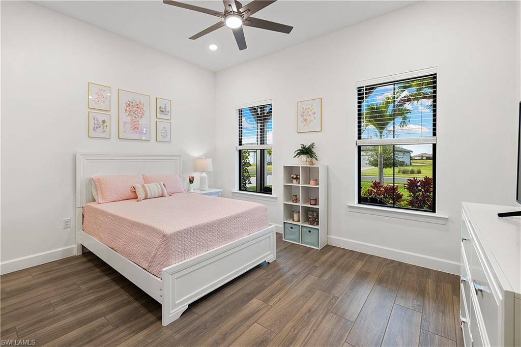 20549 Napa Loop Estero, FL 33928 - Photo 35 of 50 a bedroom with a large bed and a window