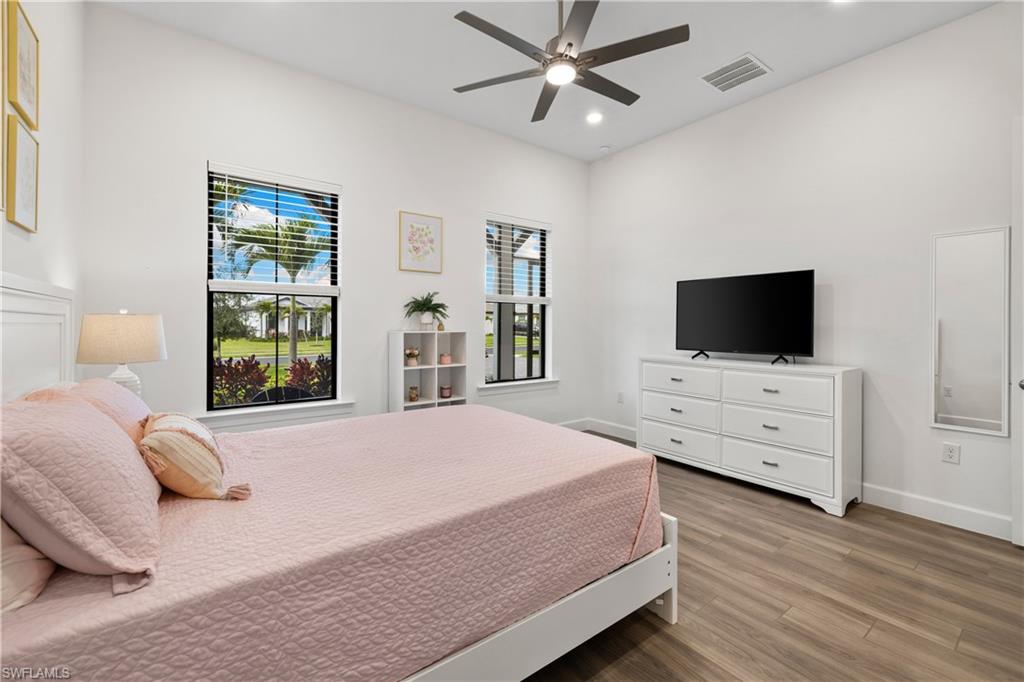 20549 Napa Loop Estero, FL 33928 - Photo 36 of 50 a bedroom with a bed and a flat screen tv