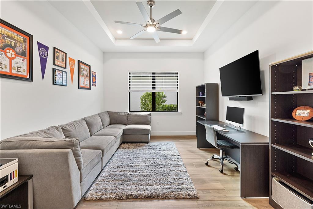 20549 Napa Loop Estero, FL 33928 - Photo 40 of 50 a living room with furniture and a flat screen tv