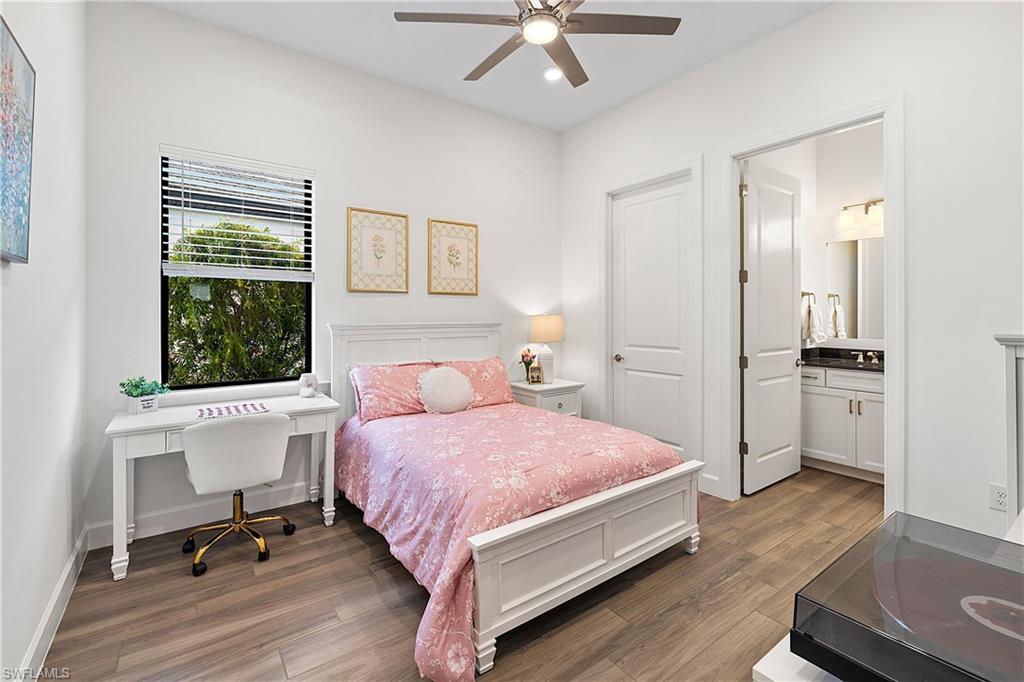 20549 Napa Loop Estero, FL 33928 - Photo 41 of 50 a bedroom with a bed and a table
