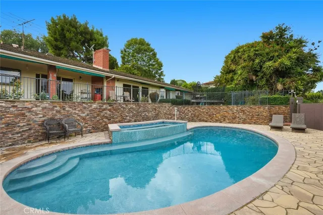 a view of a house with swimming pool