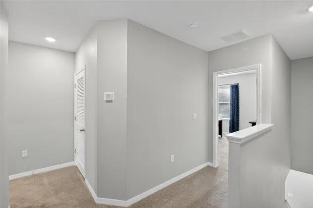 an aerial view of a house with outdoor space