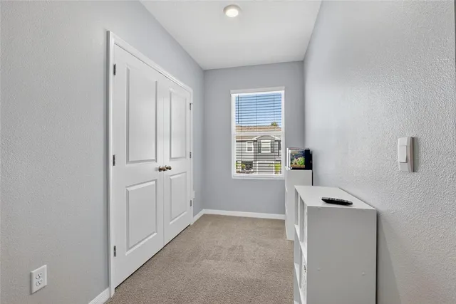 a bedroom with furniture and window