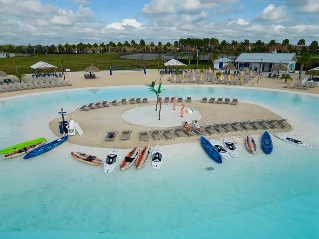 a view of a house with backyard porch and sitting area