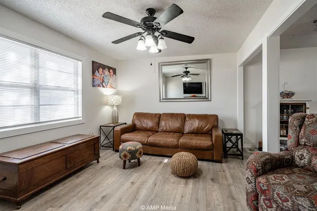 a living room with furniture and a window