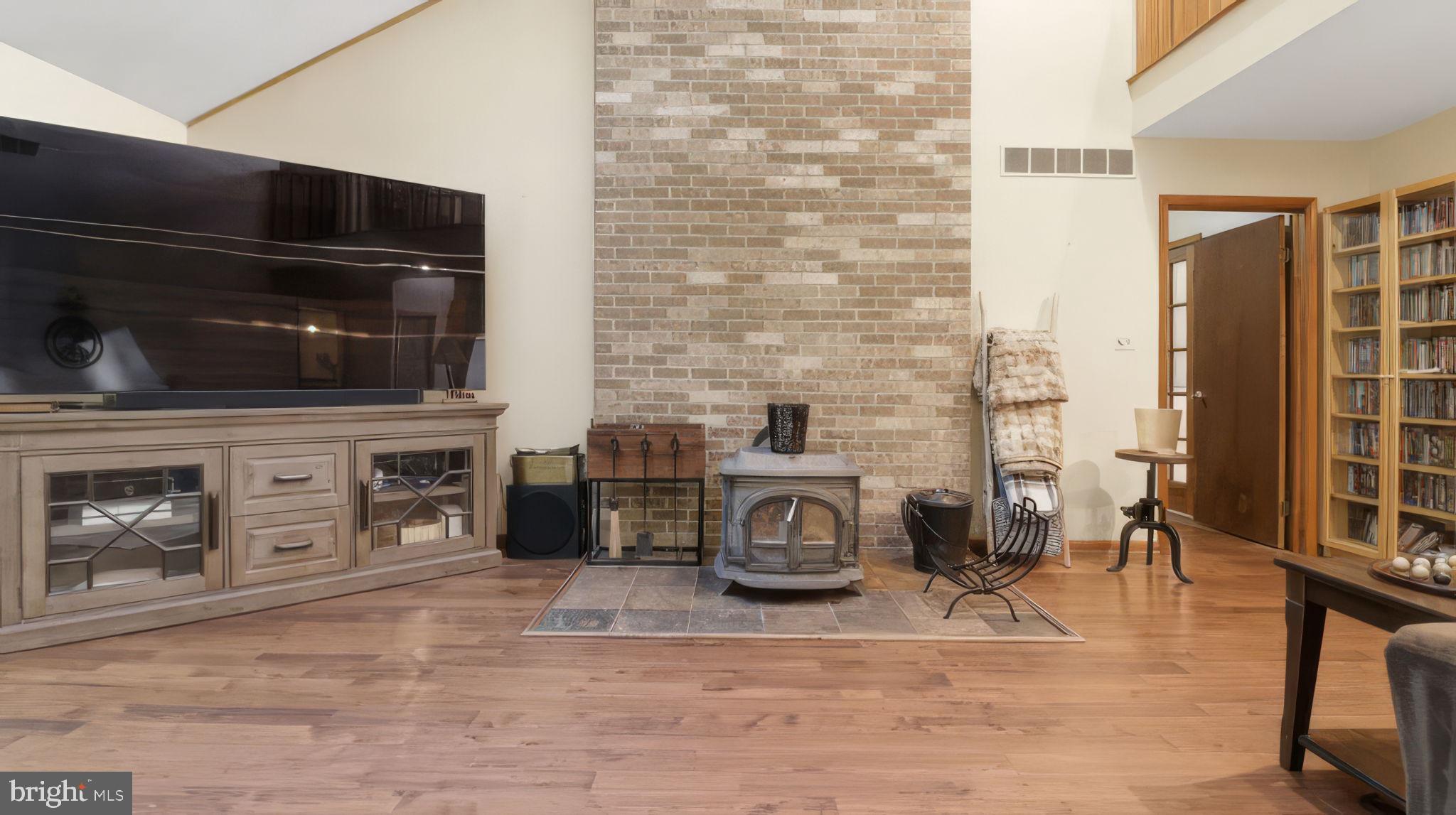 2185 Sams Creek Road Westminster, MD 21157 - Photo 9 of 56 Floor to ceiling brick hearth and wood stove