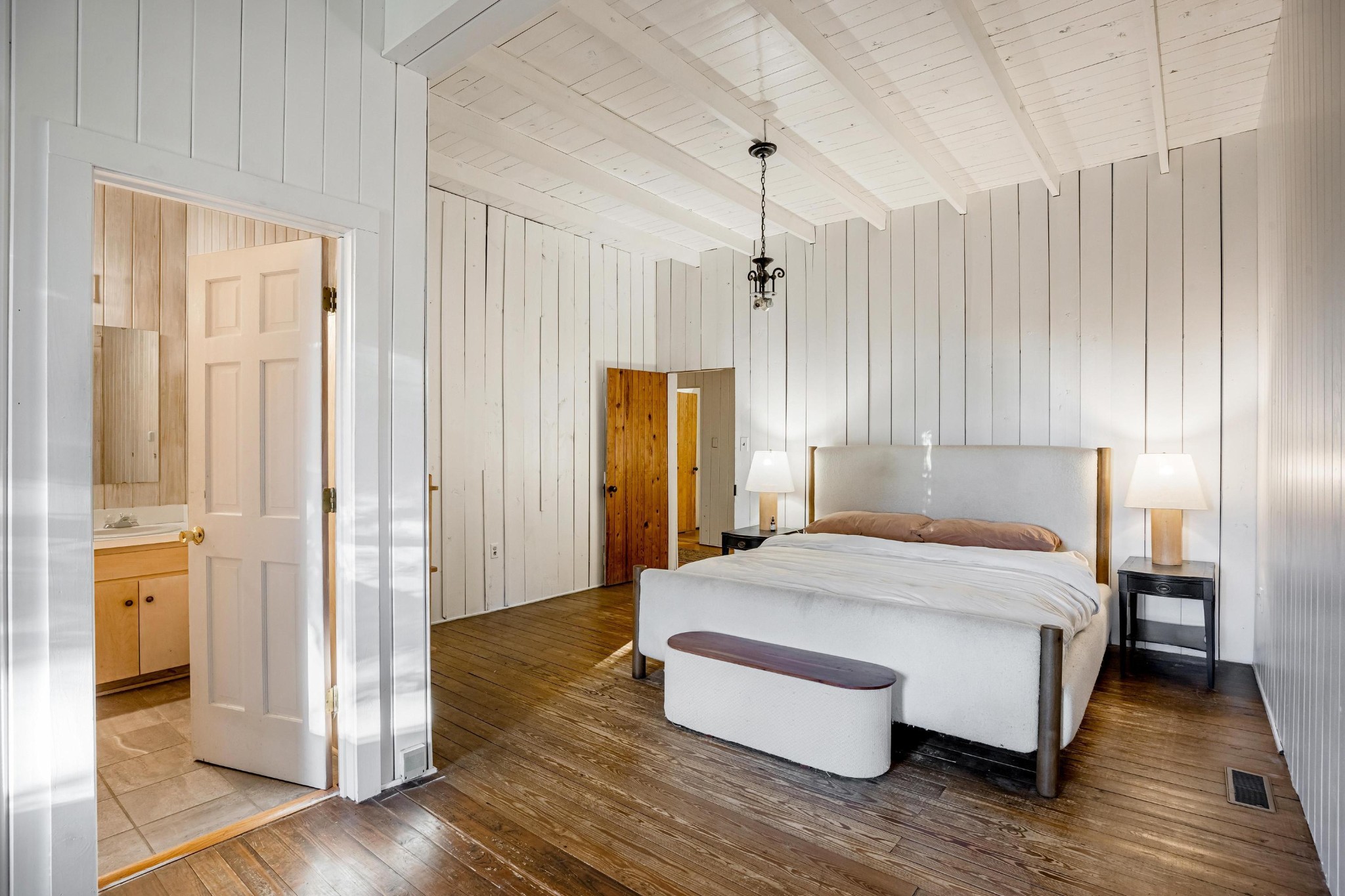 144 Parksville Road Benton, TN 37307 - Photo 23 of 64 a spacious bedroom with a bed and wooden floor