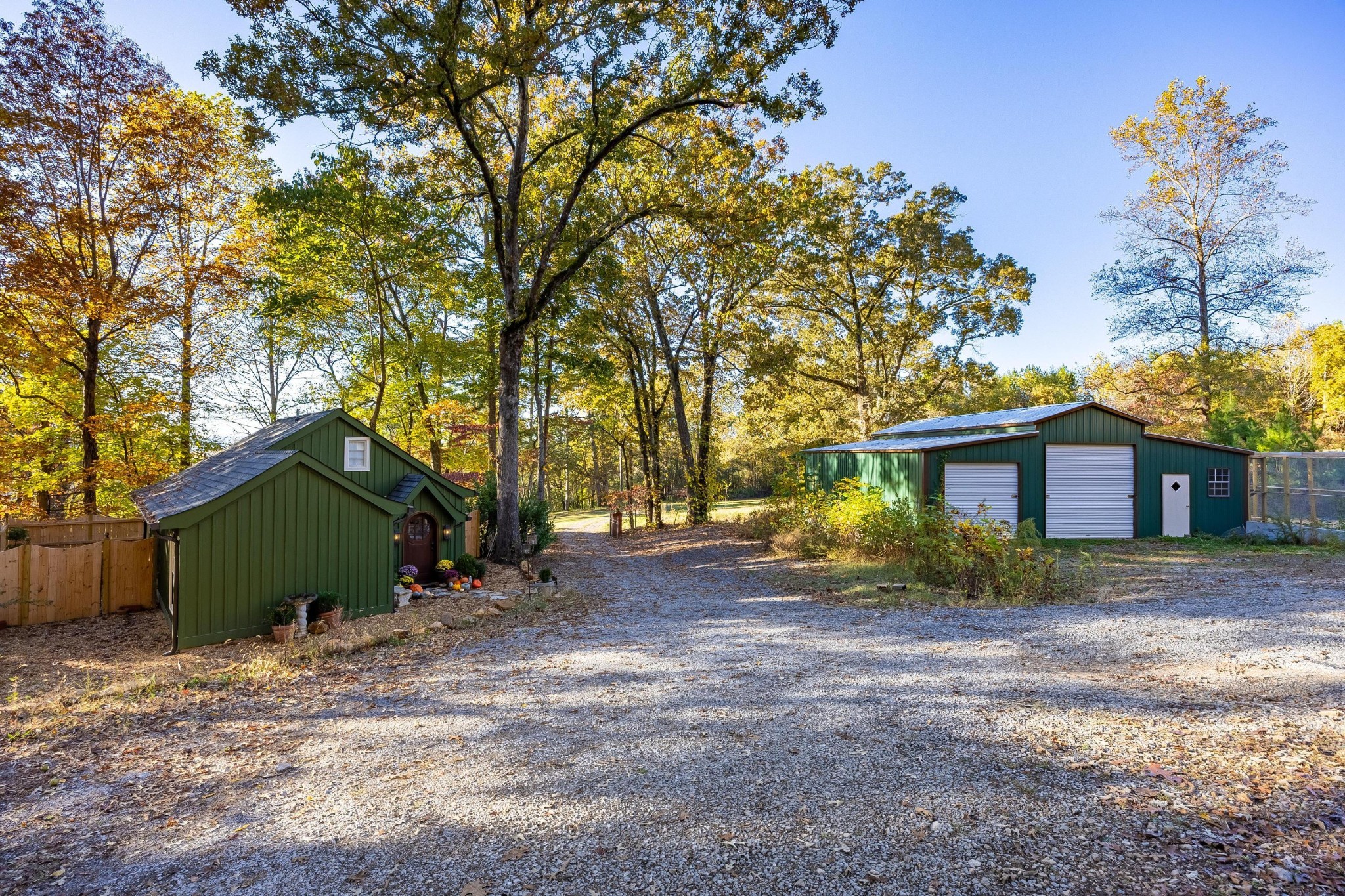 144 Parksville Road Benton, TN 37307 - Photo 52 of 64 a view of a house with a large tree and a yard