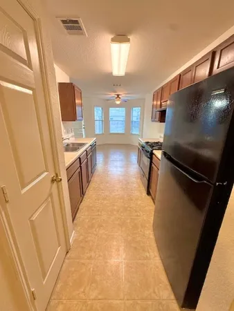 a view of living room with furniture and flat screen tv
