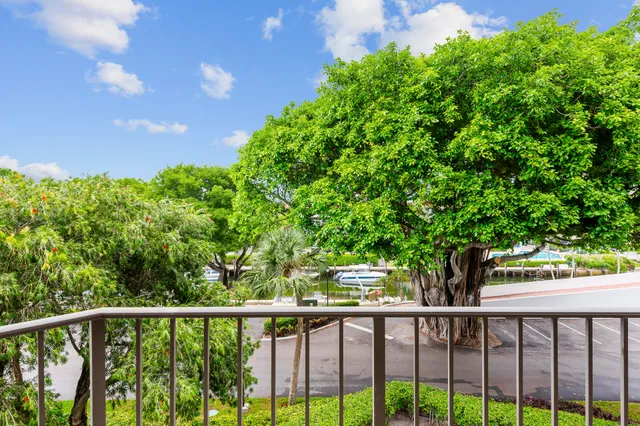 a view of a balcony with chairs and a table
