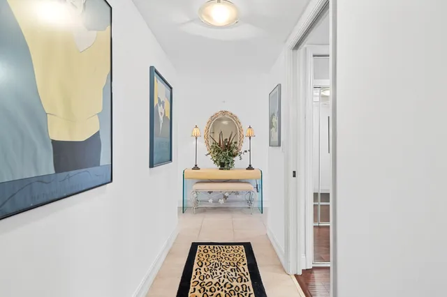 a bedroom with furniture a bed and a large window