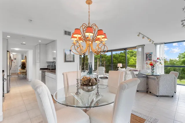 a view of balcony with wooden floor and outdoor seating