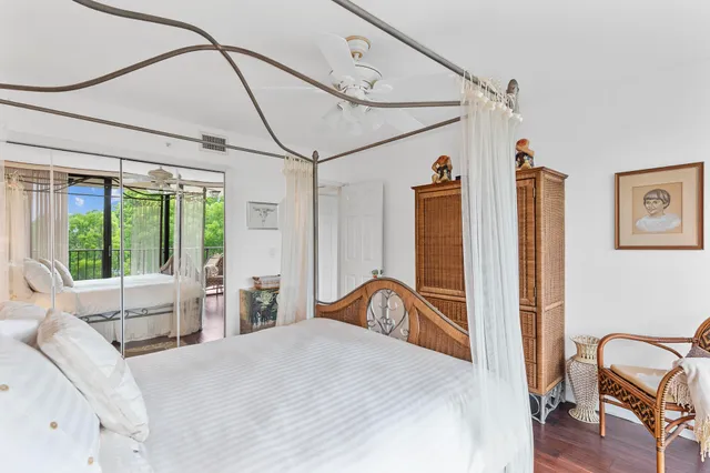 a view of a balcony with a yard