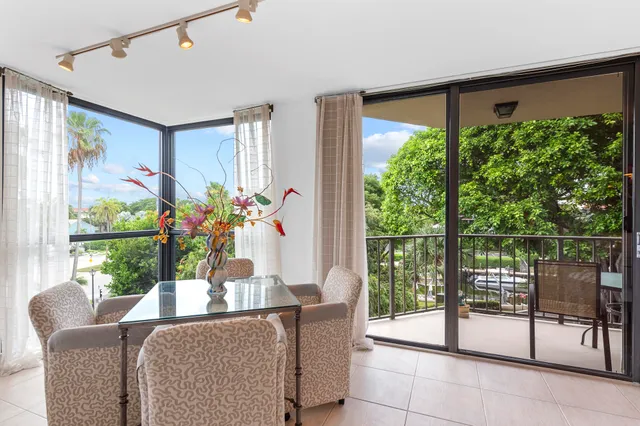 a view of a balcony with chairs
