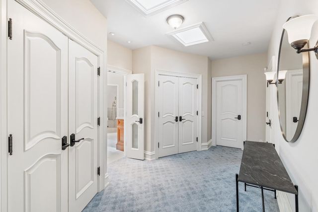 a bathroom with a tub shower and sink