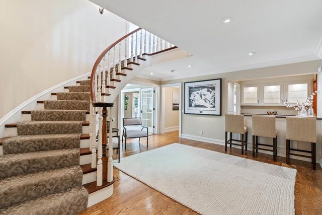 a room with furniture and a potted plant