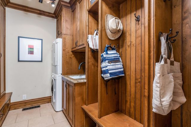 a view of a patio with couches table and chairs and potted plants