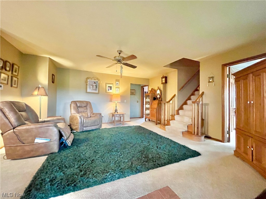 7300 Friendsville Road Lodi, OH 44254 - Photo 11 of 25 Carpeted living room featuring ceiling fan