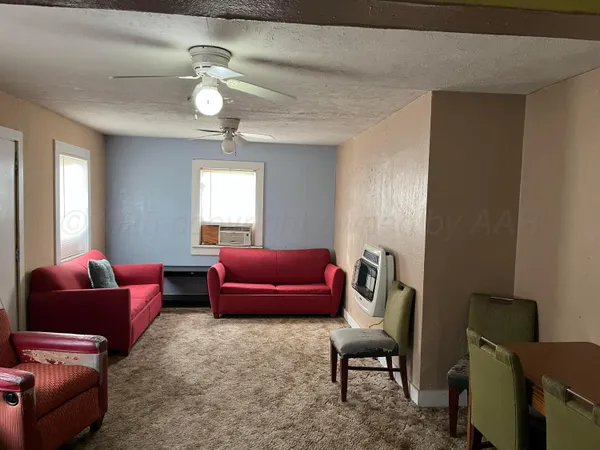 a bedroom with a bed and a chair