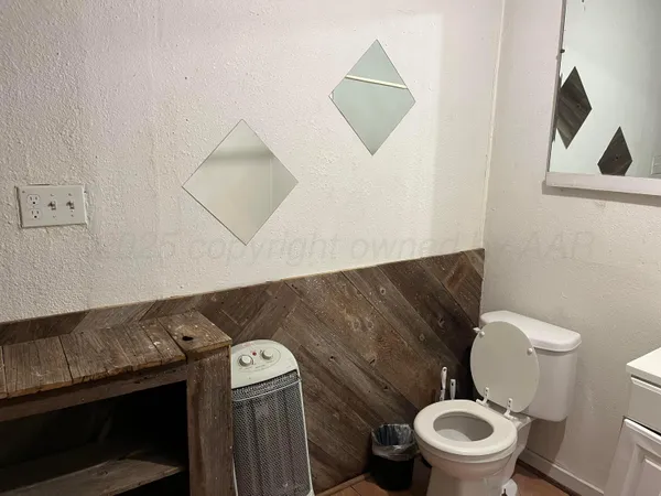 a bathroom with a toilet and a sink