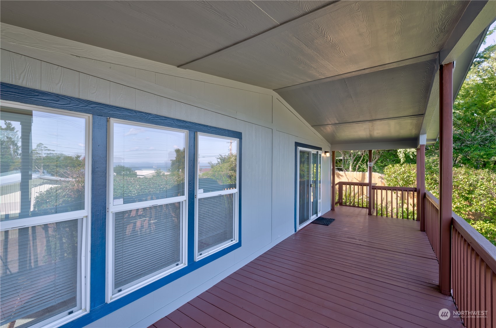 26507 Sandridge Road Nahcotta, WA 98640 - Photo 19 of 40 a view of a porch with wooden floor and outdoor space