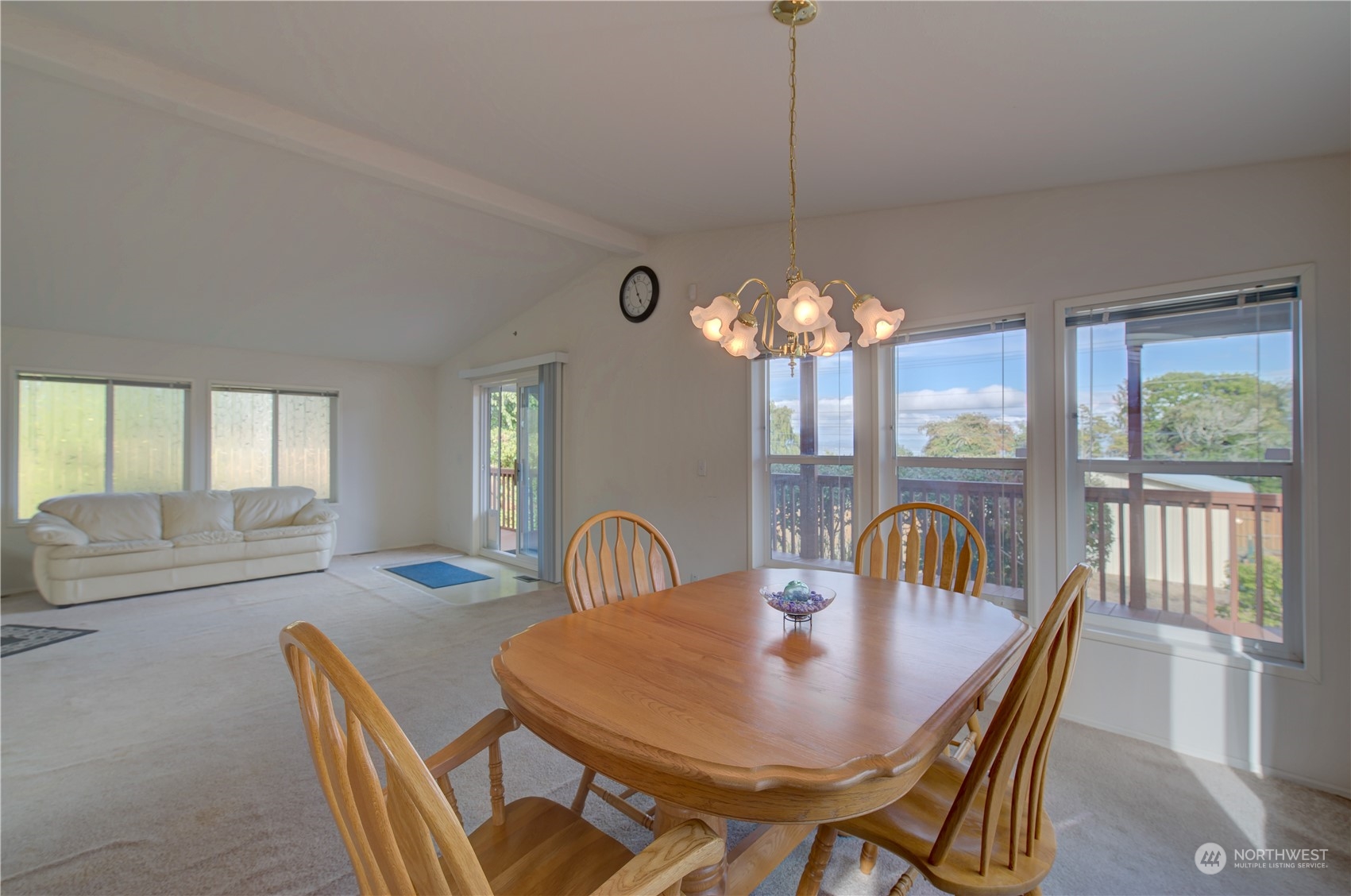 26507 Sandridge Road Nahcotta, WA 98640 - Photo 24 of 40 a dining room with furniture a chandelier and window