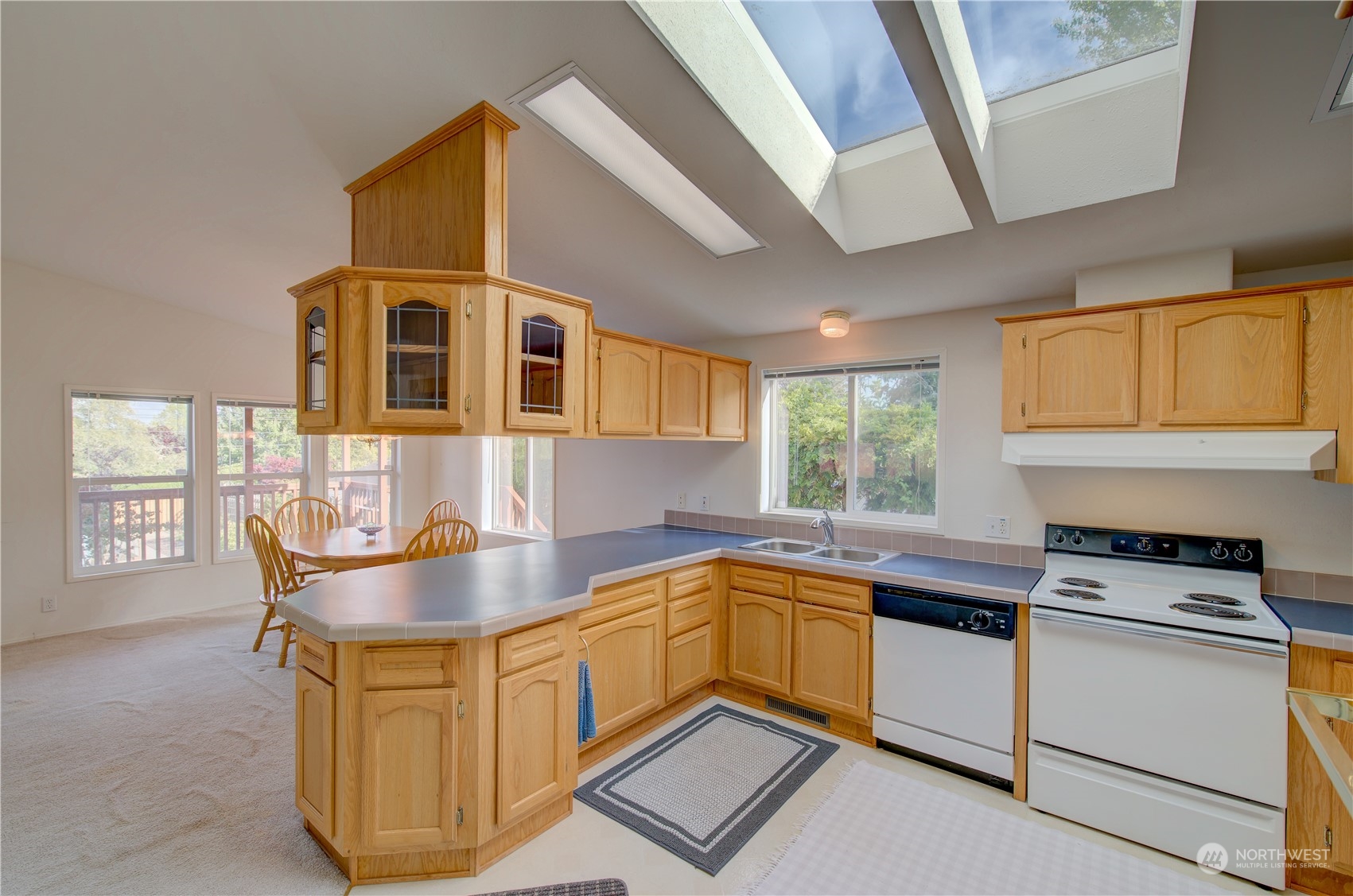 26507 Sandridge Road Nahcotta, WA 98640 - Photo 26 of 40 a kitchen with stainless steel appliances granite countertop a sink and window