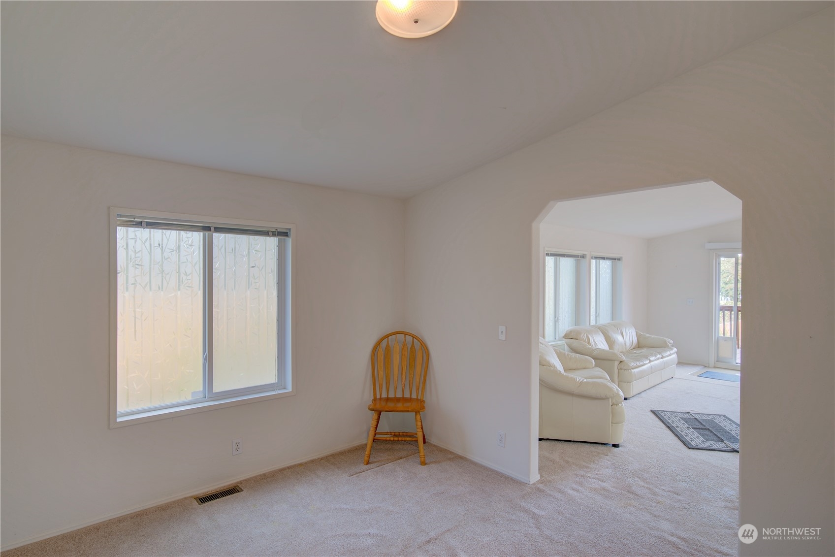 26507 Sandridge Road Nahcotta, WA 98640 - Photo 28 of 40 a living room with furniture and a window