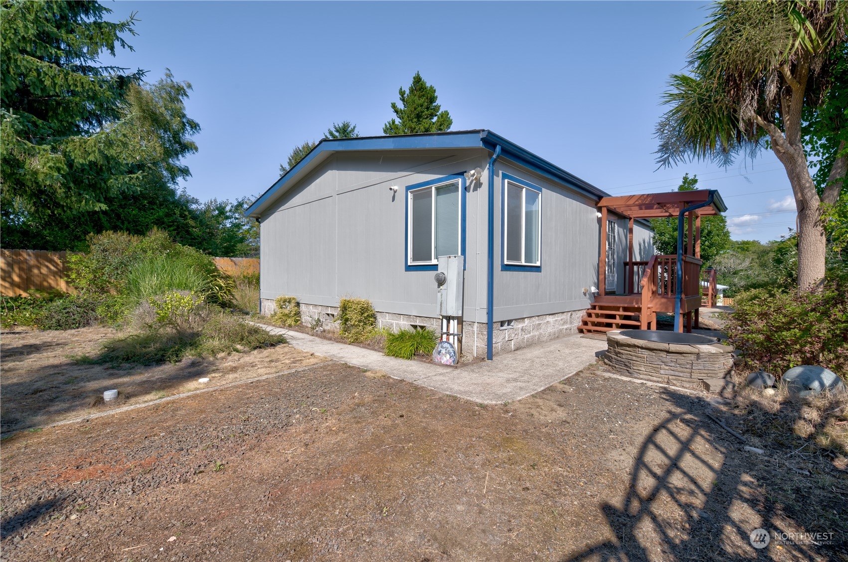 26507 Sandridge Road Nahcotta, WA 98640 - Photo 3 of 40 a front view of a house with a yard and a garage