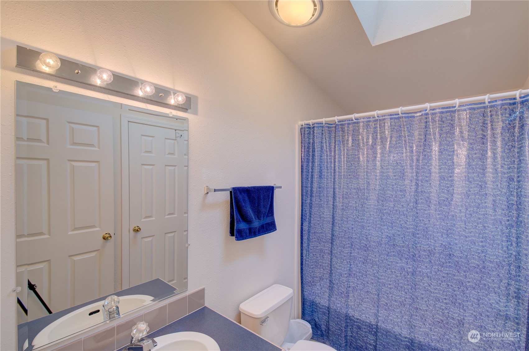 26507 Sandridge Road Nahcotta, WA 98640 - Photo 36 of 40 a bathroom with a sink and mirror