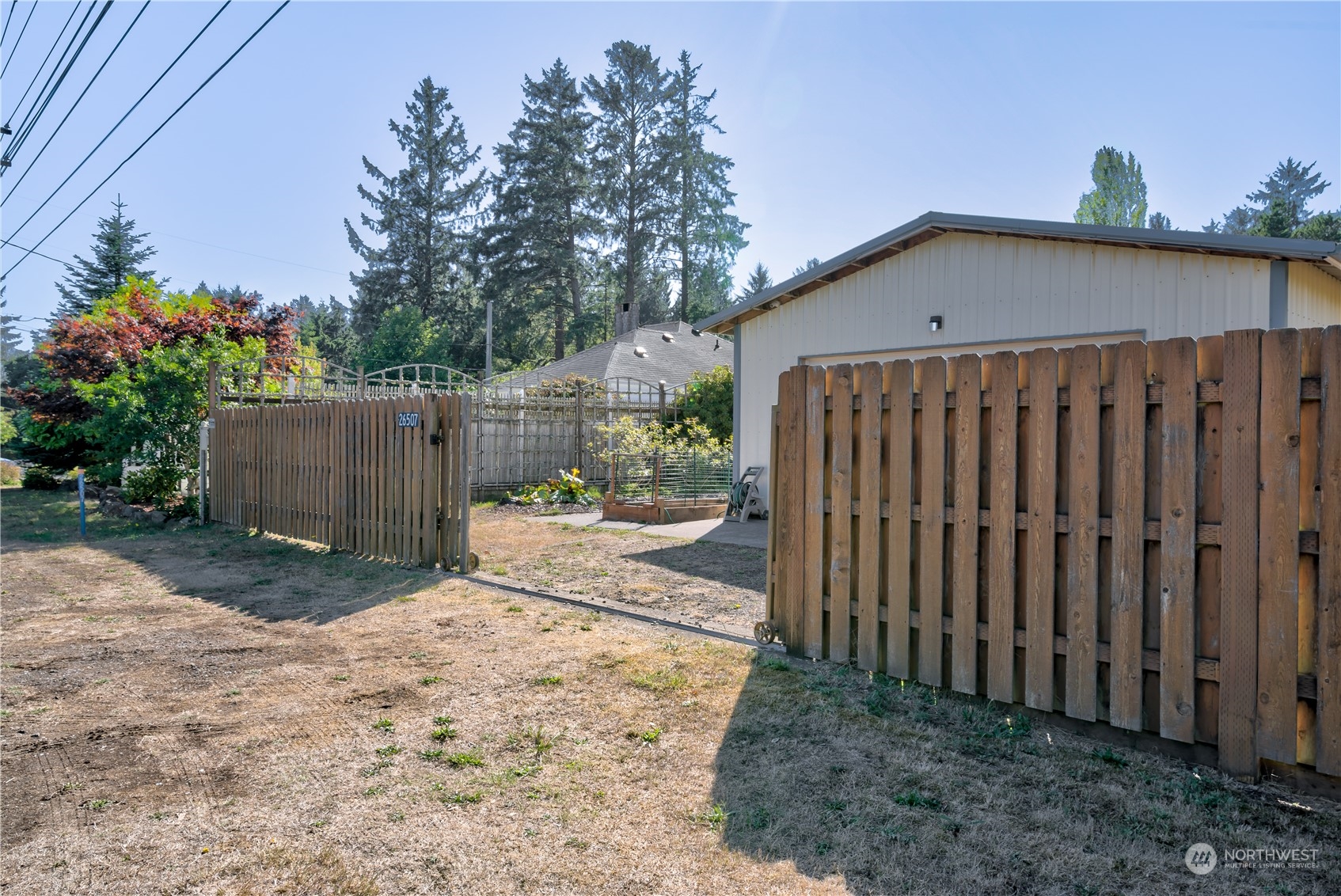 26507 Sandridge Road Nahcotta, WA 98640 - Photo 7 of 40 a view of a backyard with wooden fence