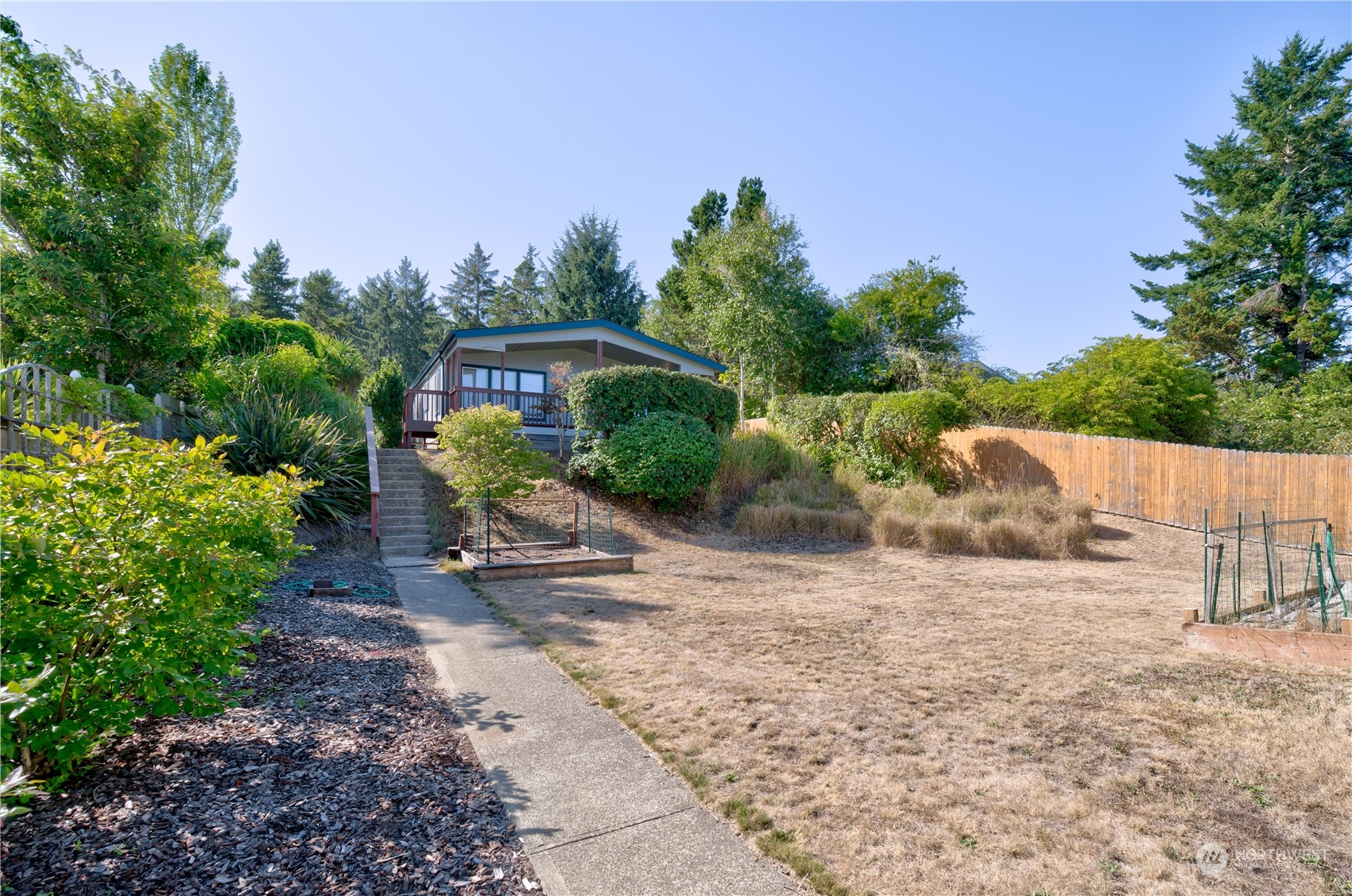 26507 Sandridge Road Nahcotta, WA 98640 - Photo 9 of 40 a view of a garden with a house in the background