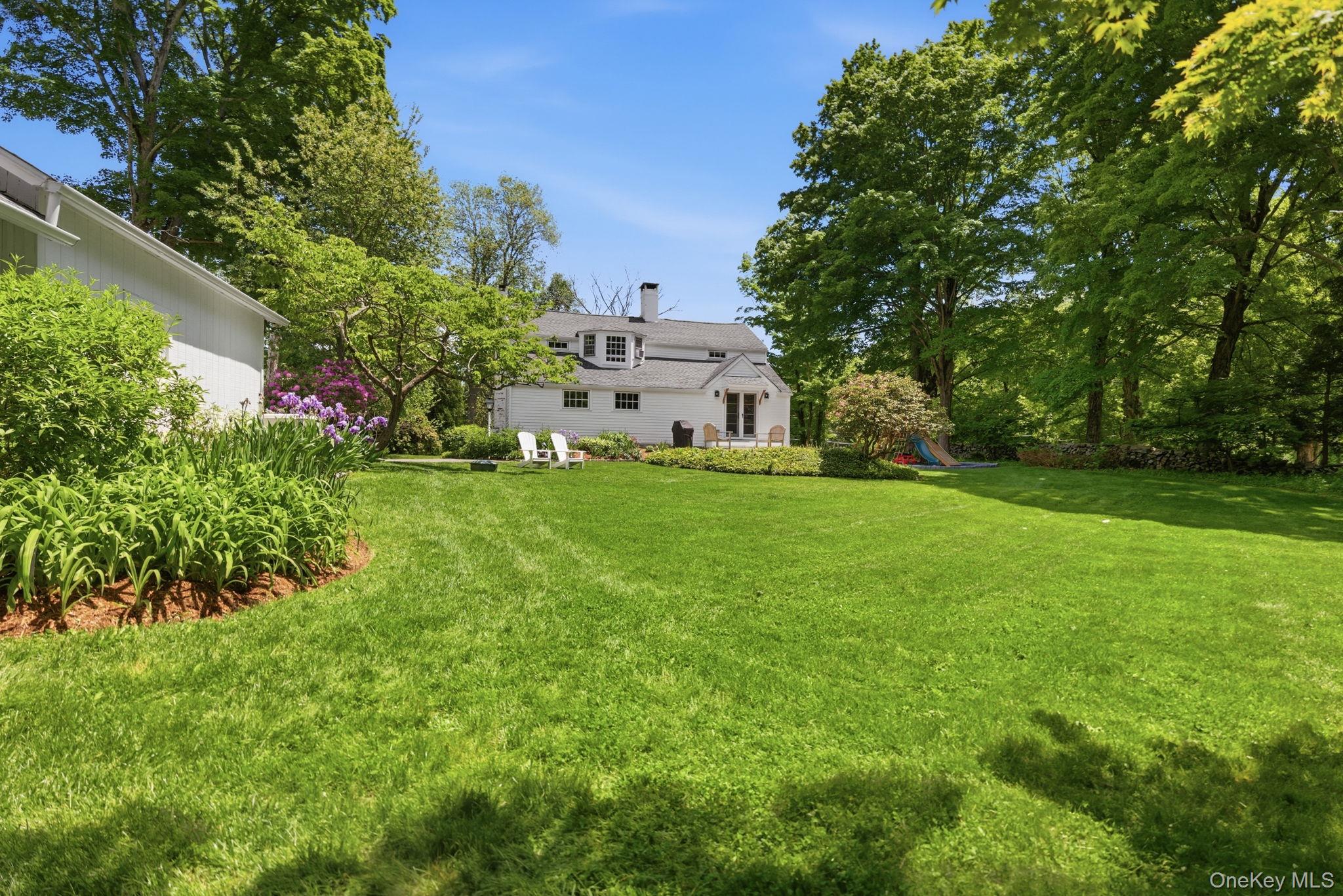 23 Pound Ridge Road Pound Ridge, NY 10576 - Photo 30 of 40 a view of house with backyard