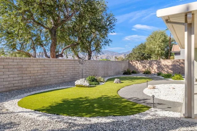 a view of a swimming pool with seating area