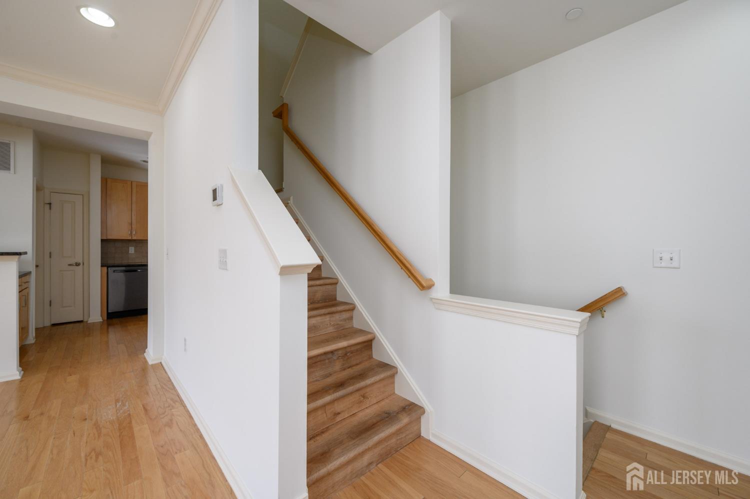 361 Lehigh Avenue Perth Amboy, NJ 08861 - Photo 13 of 28 a view of a hallway with staircase