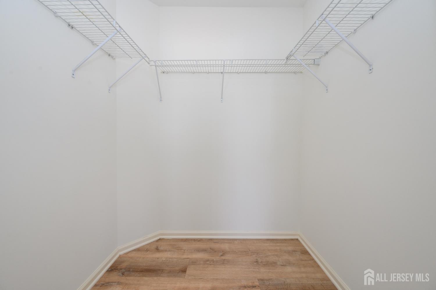 361 Lehigh Avenue Perth Amboy, NJ 08861 - Photo 17 of 28 a view of a room with racks on the wall